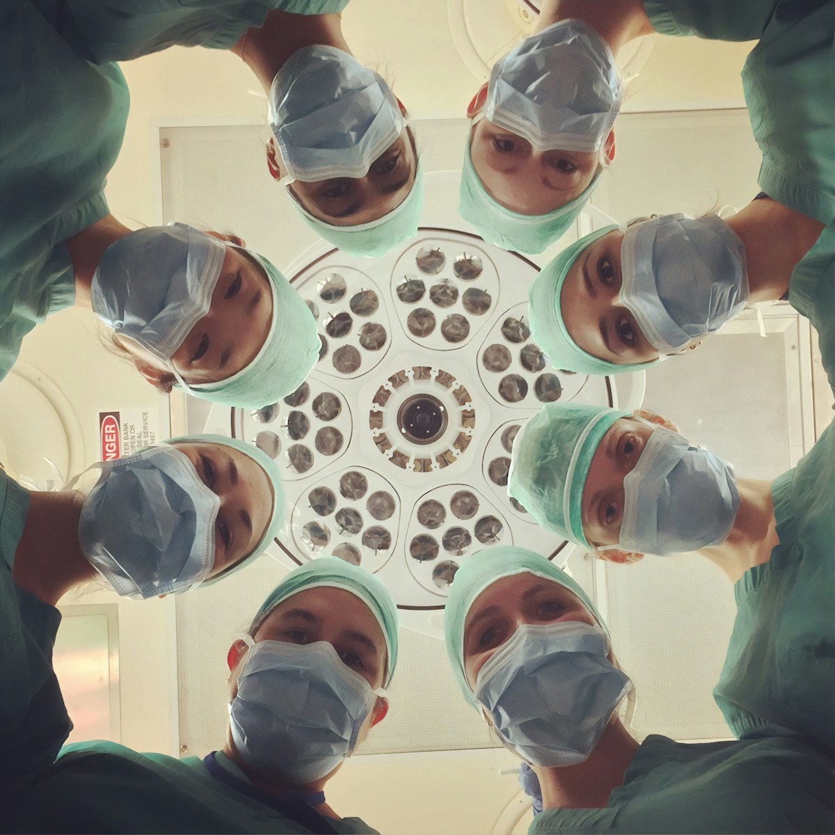 Clinical team collaborating around a patient