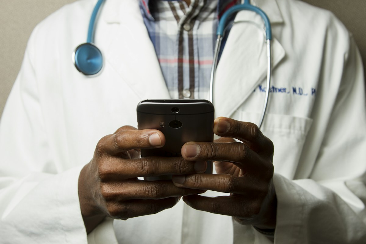 OB/GYN physician reviewing patient chart